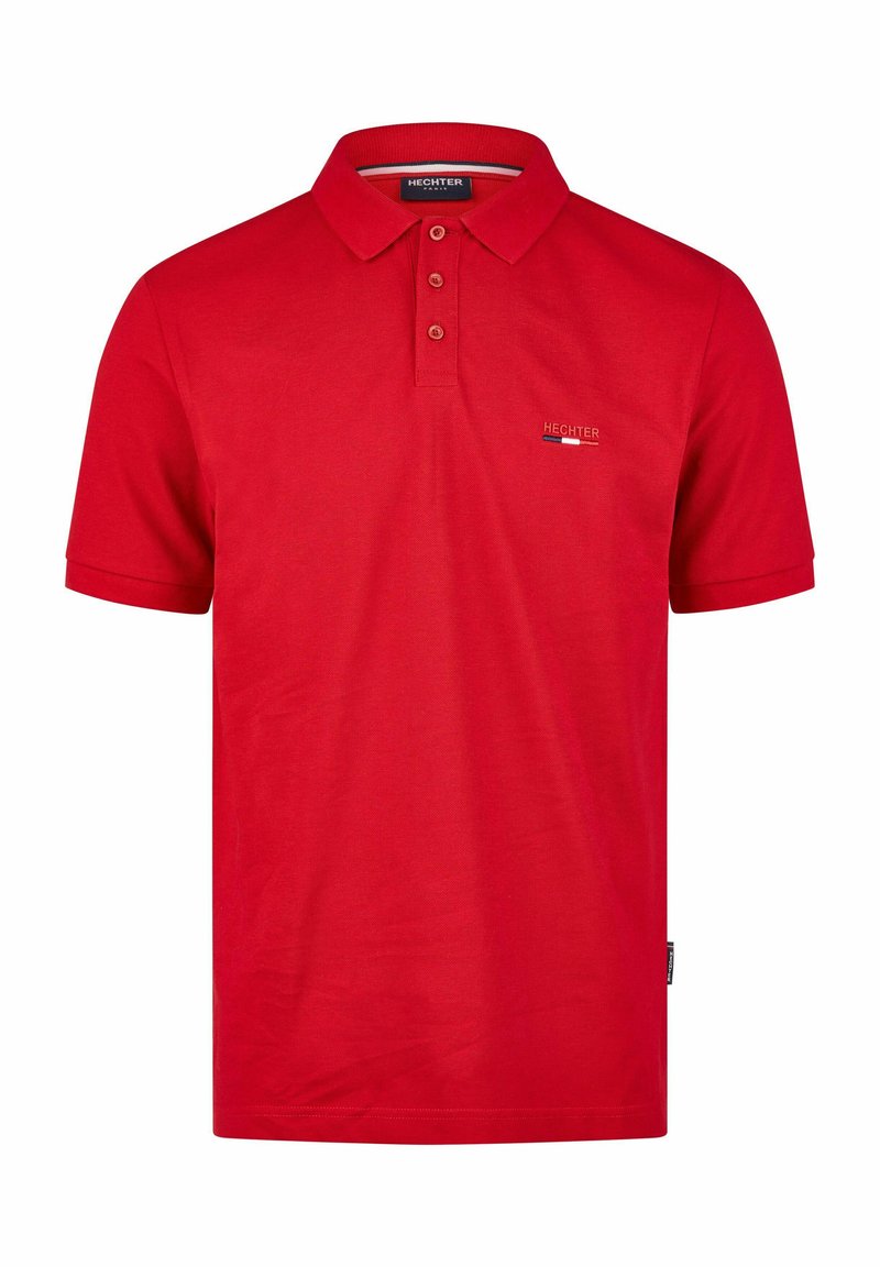 Rotes Polohemd aus Baumwolle, mit Kragen, drei Knöpfen und einem kleinen Logo. Kurzärmlig und mit geradem Schnitt.