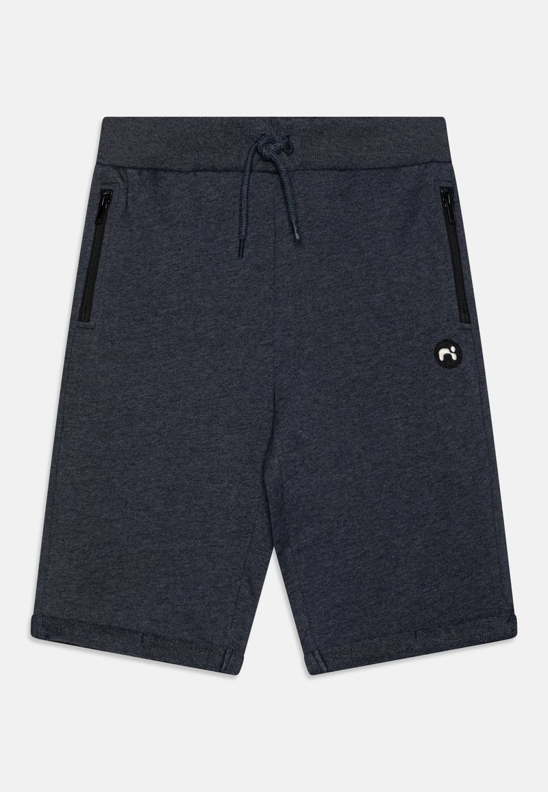 Mørkegrå treningsshorts laget av et mykt materiale, med strikkliv, to glidelåslommer og en sirkulær logoakcent.