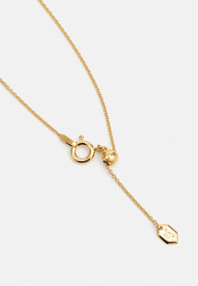 Gold necklace with a fine chain, circular clasp, and a hanging hexagonal tag marked "BLACK 925." Smooth texture with a polished finish.