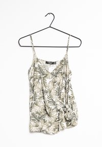 Ärm-lös topp med v-ringning, prydd med ett grönt och beige tropiskt lövmönster. Tillverkad av lätt tyg, med knutdetalj vid fållen.