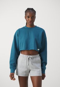 Björn Borg STUDIO OVERSIZED CROPPED CREW - Melegítőfelső - mallard blue