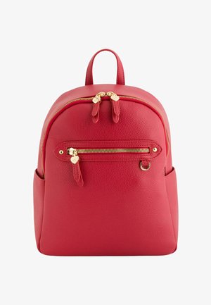 Red leather backpack with front zip pocket, gold-tone zippers and heart-shaped zipper pulls, top handle, and side pockets.
