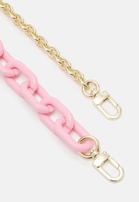 Two purse chains side by side; one with large pink plastic links, the other with smaller gold metal links, both with gold clasps.