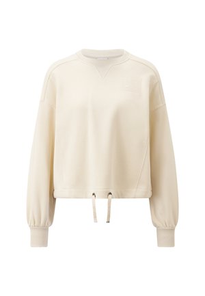 Sweatshirt cropped crème avec encolure et poignets côtelés. Présente des cordons à l'ourlet et un motif texturé sur la poitrine.