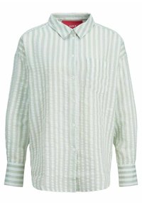 Camisa de botones a rayas verde claro y blanca, con mangas largas, cuello y un bolsillo en el pecho. Hecha de un tejido texturizado con un corte relajado.