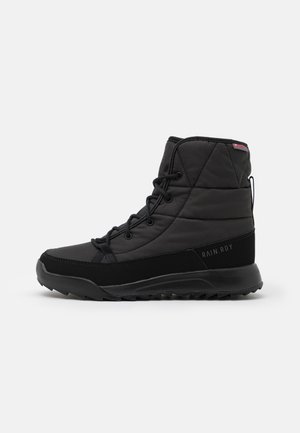 Black insulated boots with a quilted finish, featuring lace-up design, durable rubber sole, and textured accents with "RAIN.RDY" branding.