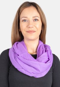 Purple lightweight scarf made of soft, textured fabric, styled in loops around the neck, complementing a black top.