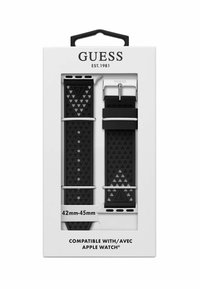 Bracelet Apple Watch en silicone noir avec des motifs triangulaires texturés, quincaillerie argentée, deux longueurs de bracelet, emballé dans une boîte blanche.
