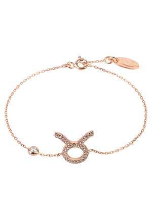 Rose gold bracelet with a Taurus symbol inlaid with clear stones, featuring a small round stone and a clasp with brand tag.