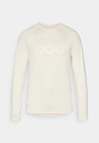 Pitkähihainen, vaalean kermaa oleva paita, jossa on pyöreä pääntie. Edessä on suuri, hillitty valkoinen "POC" -logo. Pehmeä ja kevyt kangas.