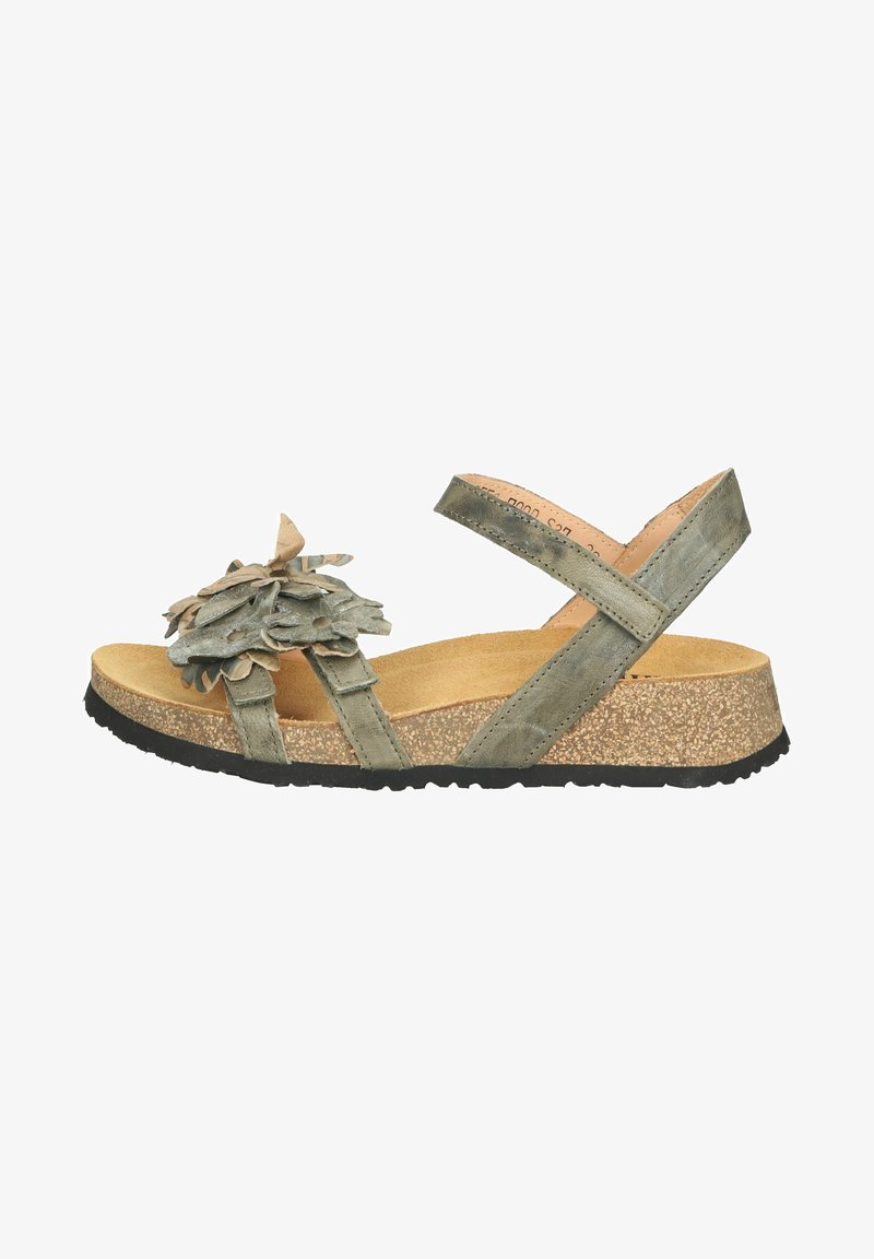 Zelené sandály s květinovou dekorací, korkovou stélkou, texturovanými pásky a gumovou podešví. Mají nastavitelné pásky kolem kotníku pro lepší přizpůsobení.