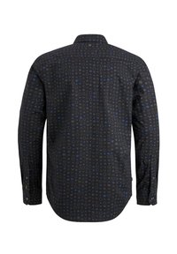 Chemise noire à manches longues avec un col ouvert, présentant un motif de petits cercles et triangles en bleu et gris, vue de dos.