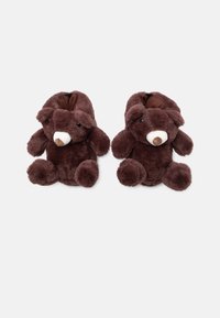 Smeđe plišane papuče u obliku medvjeda s zaobljenim oblicima, mekom teksturom i bijelim njuškama. Svaka papuča ima izšivene oči i udoban unutarnji oblog.