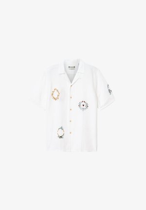 Camicia bianca a maniche corte con collo e bottoni, con ricamo di piccole corone floreali in giallo, verde, rosso e nero sul davanti e sulla manica.