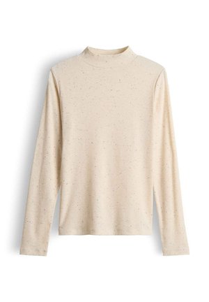 Haut à col roulé à manches longues de couleur beige clair, en tissu côtelé, doté de légères speckles de couleurs sombres, avec une silhouette ajustée et un col haut.