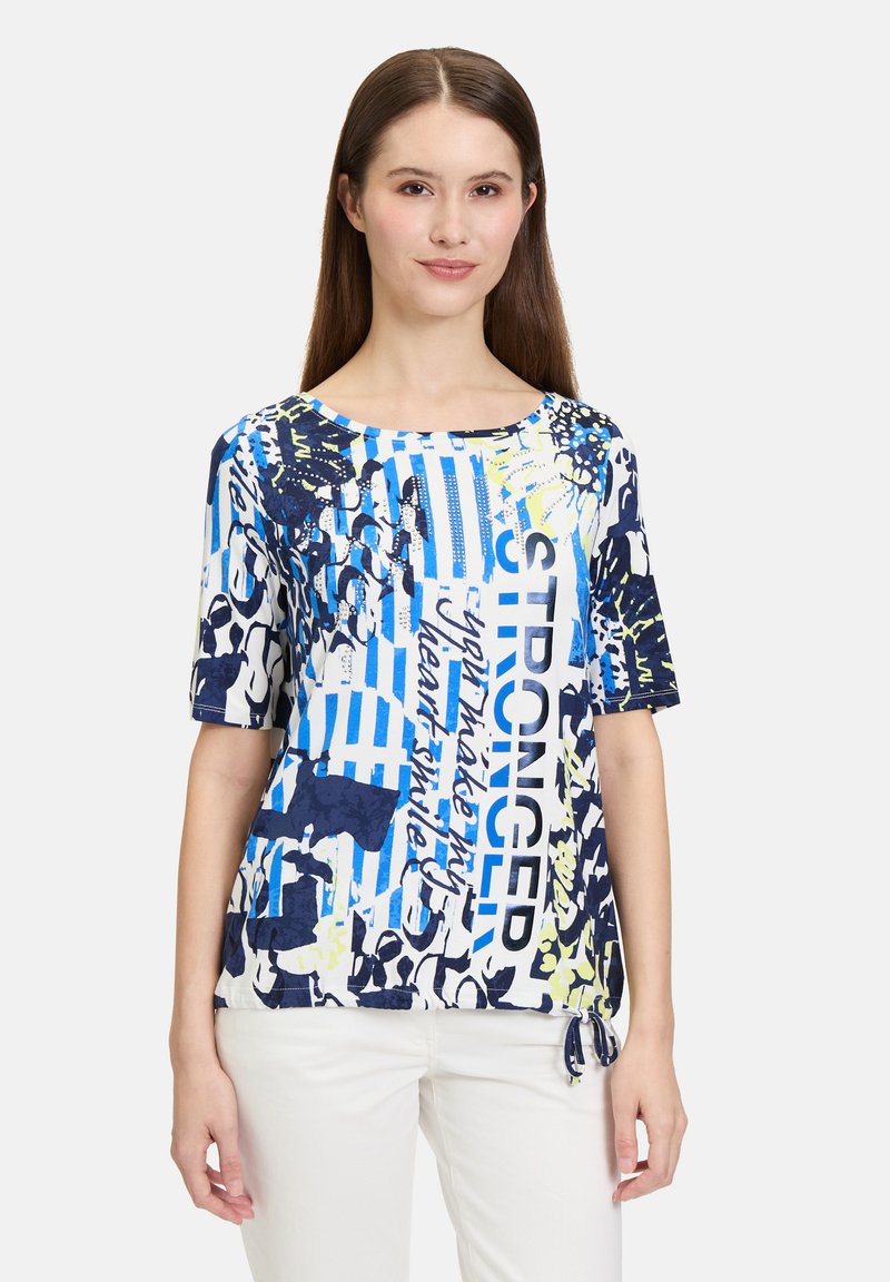Short-sleeve, crew neck t-shirt in blue and white with graphic text and abstract patterns. Features a drawstring at the hem. Lightweight fabric.