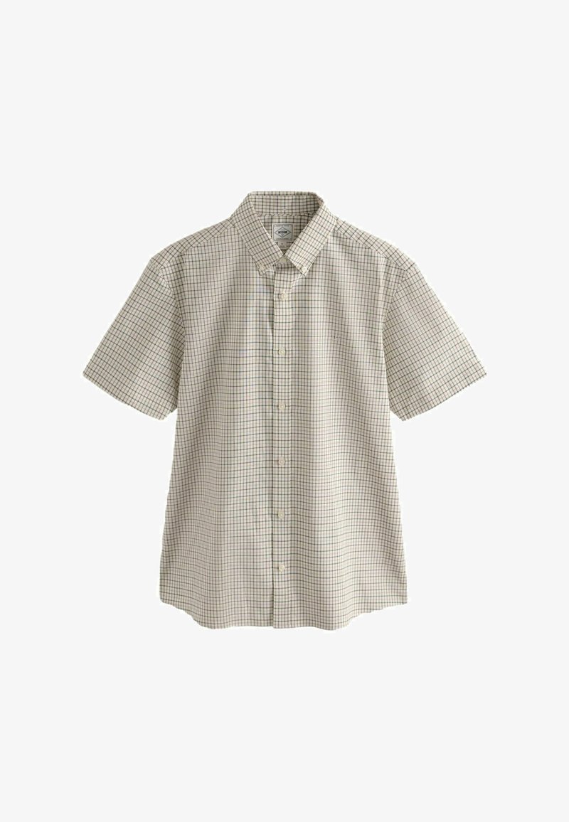 Chemise beige à manches courtes avec des boutons, motif à carreaux et col boutonné.