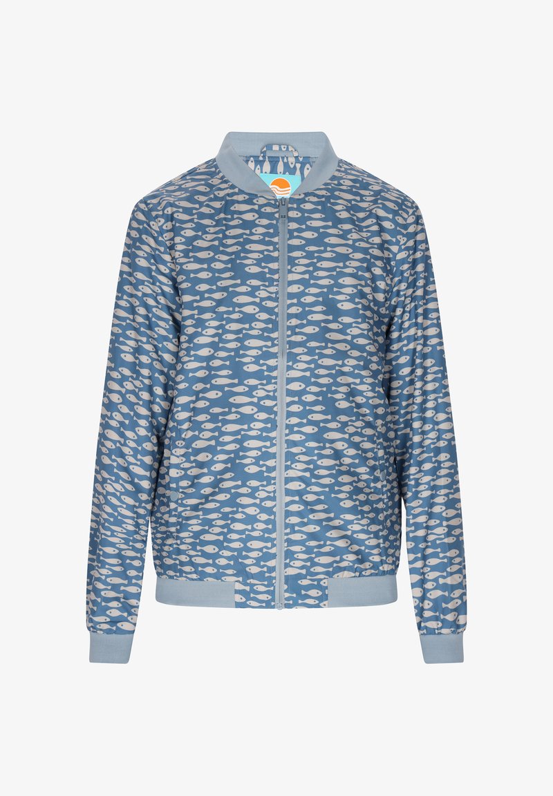 Sininen pommittajatakki, jossa on valkoinen kalakuvio. Kevyestä materiaalista valmistettu takki, jossa on vetoketjusulku ja resorit hihansuissa ja helmassa.