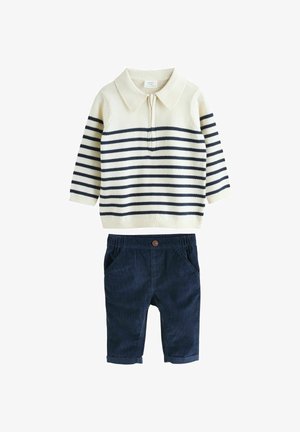Striped pullover in cream and navy with a collar, paired with navy corduroy shorts featuring a front button and pockets.