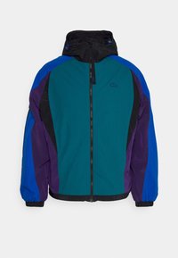 Colorful jacket featuring a teal body, blue and purple sleeves, and a black hood. Design includes a front zipper and elastic cuffs.
