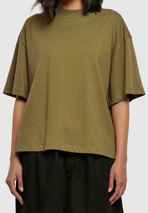 Oversized olive green cotton t-shirt with a high neckline and dropped shoulders, featuring short sleeves and a straight hem.