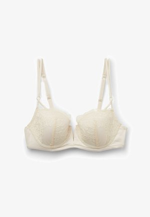 Unterstützender BH aus Spitze und Satin in hellem Creme. Mit verstellbaren Trägern und floralen Spitzenakzenten an den Cups sowie weicher Polsterung.