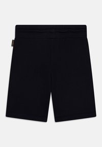 Zwarte katoenen shorts met een elastische tailleband, met een zachte textuur en een rechte snit, zonder zichtbare patronen of accenten.