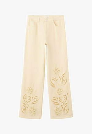 Pantalones color crema de pierna ancha con bordado floral recortado en la parte inferior de las piernas y en los bolsillos delanteros.