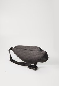 Black textured sling bag with a diamond pattern, featuring a sturdy strap and a streamlined shape, suitable for casual use.