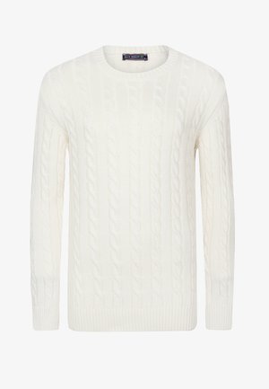 Valge kabli-kootud sviiter ümmarguse kaelusega ja pikkade varrukatega. Omab tekstuuriga mustreid ning soonikkoes mansette ja ääre. Pehme kootud kangas.