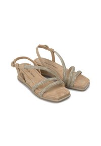 Sandales beiges avec plusieurs brides croisées, détails scintillants transparents et un faible talon carré, présentant une texture douce semblable à du daim.
