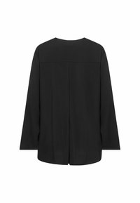 Top noir à manches longues en coupe ample, avec un décolleté arrondi, une coupe droite et un détail de couture au niveau du haut du dos. Texture lisse.