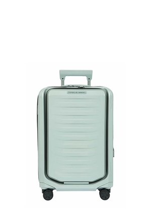 Hellgrauer Hartschalen-Handgepäckkoffer mit vier Rollen, ausziehbarem Griff und "Porsche Design"-Logo auf der Vorderseite.