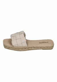 Beige slide sandal with a woven strap and espadrille-style sole. Features a flat profile and a smooth, soft texture.