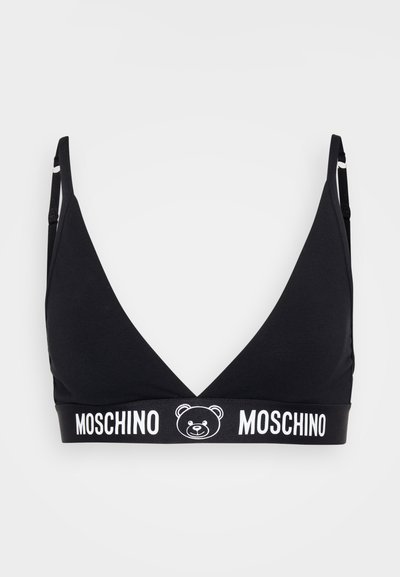 Black bralette with a V-neck design. Made of smooth fabric, featuring a white bear logo and "MOSCHINO" text on the elastic band.