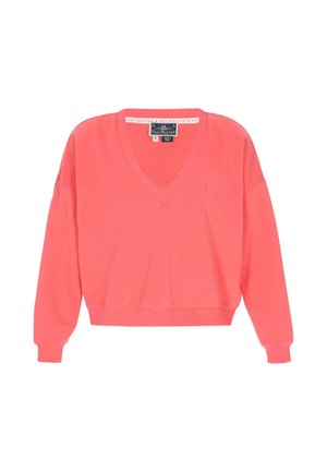 Coral pink V-neck sweater made of a soft, lightweight fabric. Features long sleeves and ribbed cuffs with a small logo accent on the chest.