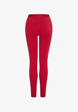 Leggings rossi con una texture liscia, vestibilità aderente e una vita elasticizzata. Progettati per il comfort e la flessibilità nei movimenti.