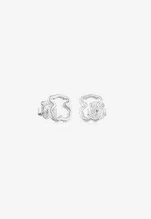 Silver earrings shaped like a bear, featuring an outline design. Smooth, shiny finish with clip-on fasteners and a minimalist style.