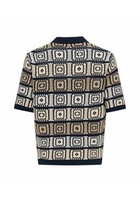 Polo à manches courtes avec un motif géométrique en beige, bleu marine et blanc. Texture tricotée avec un col et des poignets bleu marine.