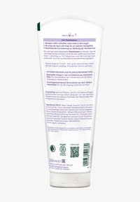Tył tubki 200 ml balsamu do mycia 3w1 Weleda z informacjami o produkcie, zastosowaniu, składnikach, certyfikatach i kodem kreskowym w języku niemieckim.