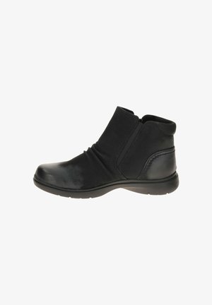Bottines noires avec un mélange de cuir lisse et texturé, des panneaux élastiques sur les côtés et un bout arrondi sur une semelle en caoutchouc flexible.
