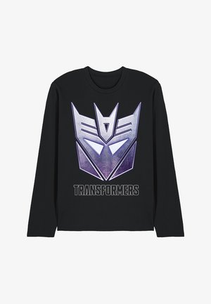 Black long-sleeve t-shirt featuring a large purple and silver Transformers logo with the text "TRANSFORMERS" in bold below the graphic.