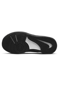 Black rubber sneaker sole with textured grip pattern, featuring a prominent white section and Nike logo detail on the side.
