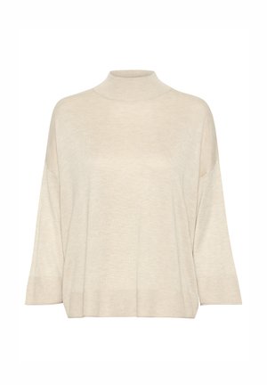 Beige turtleneck sweater lavet af blødt strikket stof, med en afslappet pasform, brede ærmer og ribbede detaljer ved kanten og ærmerne.