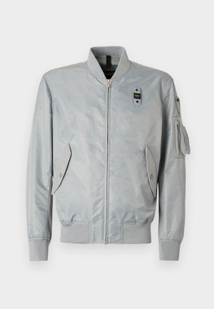 Light gray bomber jacket made of smooth fabric, featuring a zip front, ribbed cuffs, side pockets, and a decorative arm pocket.