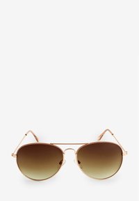 Gafas de sol aviador redondas con un marco de metal color oro rosa, lentes marrones degradados y patillas delgadas. Sin patrones ni acentos visibles.