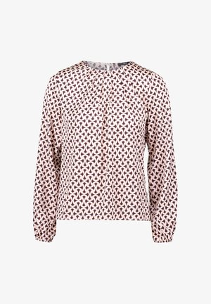 Long-sleeve blouse in light pink with a geometric dark purple pattern. Features a round neckline and gathered cuffs for a relaxed fit.