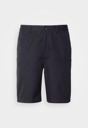 Tumepruunid lühikesed püksid kergest puuvillast kangast, millel on nööbiga sulgemine, vöökohad ja sirge lõige põlve kohal.