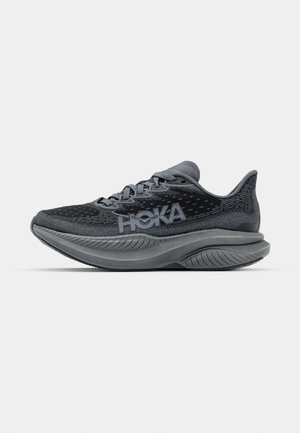 Hoka running shoe in shades of grey, featuring a breathable mesh upper, cushioned midsole, and textured outsole for enhanced grip.