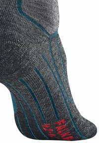 Graue Socke mit türkisfarbenen Akzenten und strukturiertem Design. Verbesserte Passform durch Rippungen und rote Druckdetails im Zehenbereich.